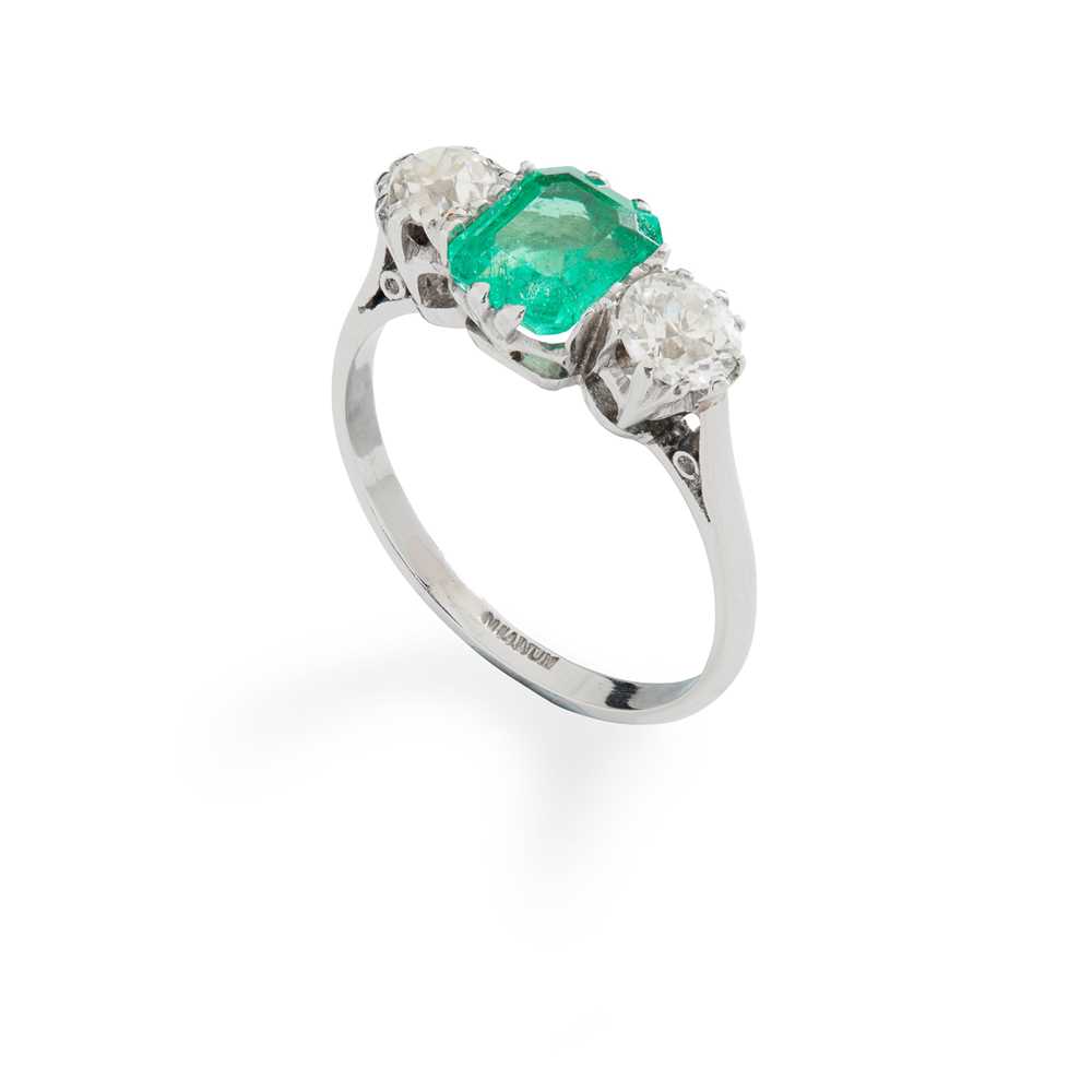 Lot 8 - An emerald and diamond three-stone ring