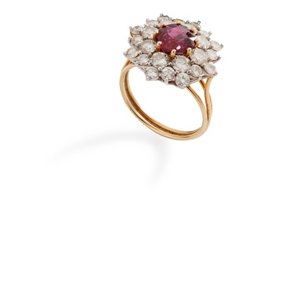Lot 73 - A ruby and diamond cluster ring