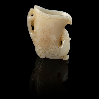Lot 137 - WHITE JADE 'PHOENIX AND CHI DRAGON' LIBATION CUP