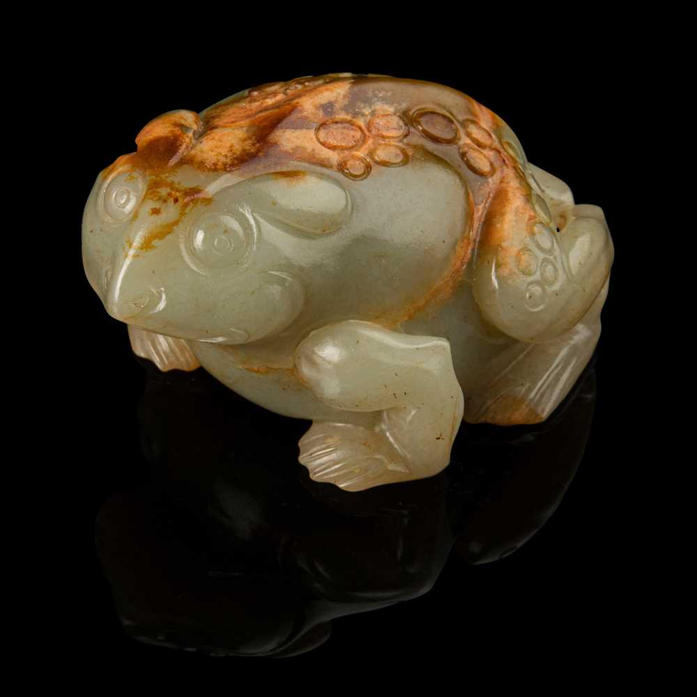 Lot 121 - CELADON JADE WITH RUSSET SKIN CARVING OF A TOAD