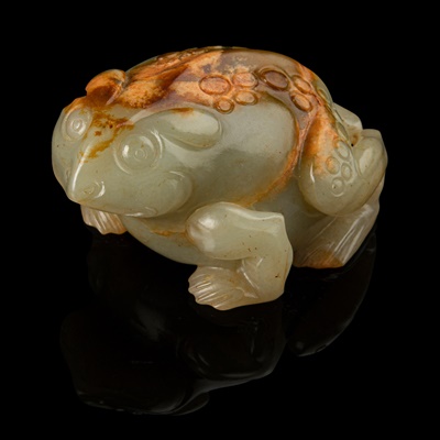 Lot 121 - CELADON JADE WITH RUSSET SKIN CARVING OF A TOAD