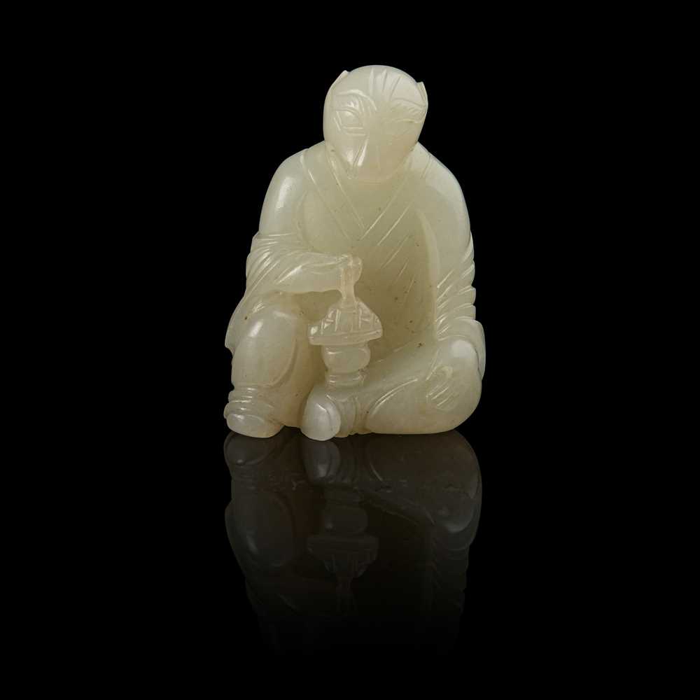 Lot 127 - WHITE JADE CARVING OF A TIGER DEITY