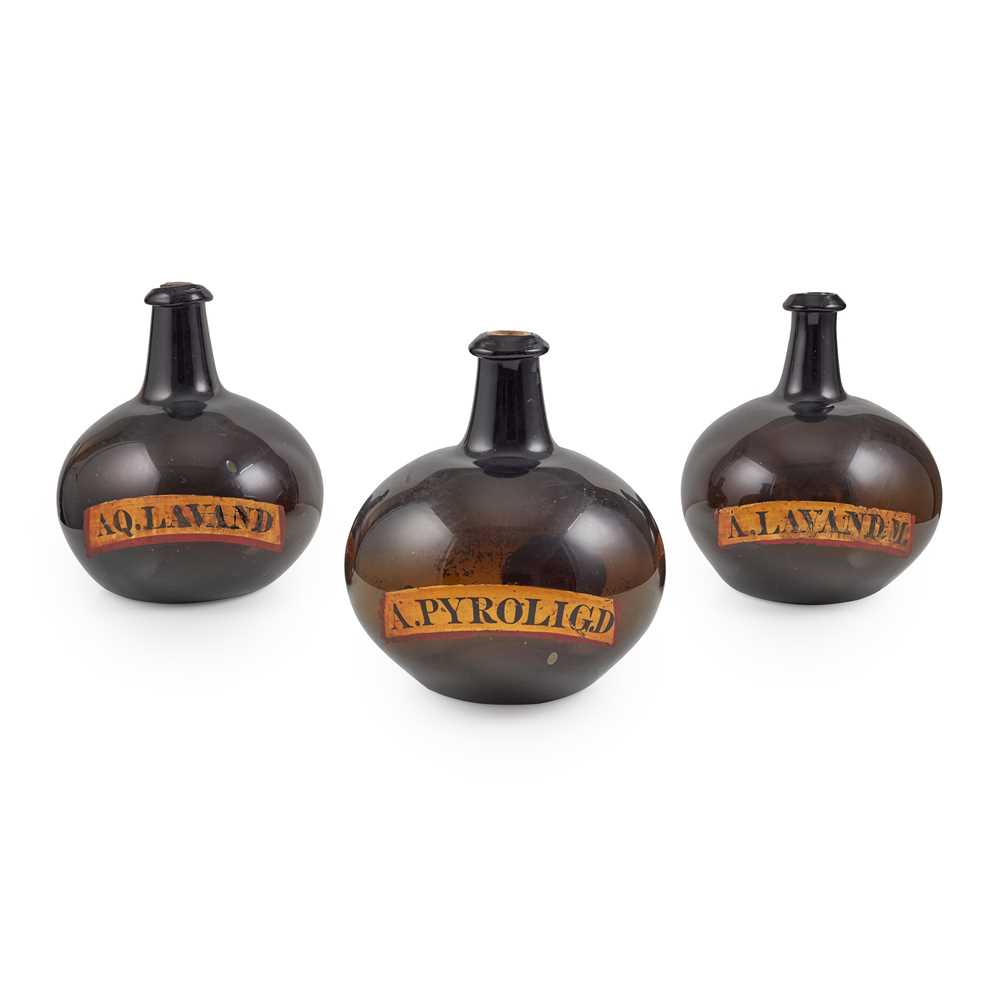 Lot 39 - SET OF THREE LARGE AMBER GLASS APOTHECARY BOTTLES