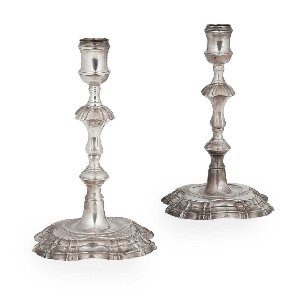 Lot 110 - A pair of George II candlesticks