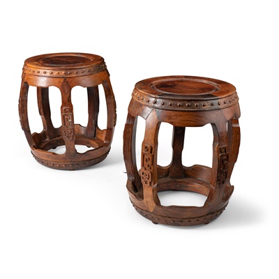 Lot 21 - PAIR OF HUANGHUALI AND HARDWOOD CARVED DRUM FORM STOOLS