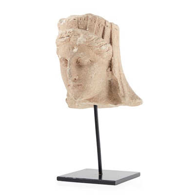 Lot 419 - CYPRIOT LIMESTONE HEAD OF A GODDESS, LIKELY APHRODITE