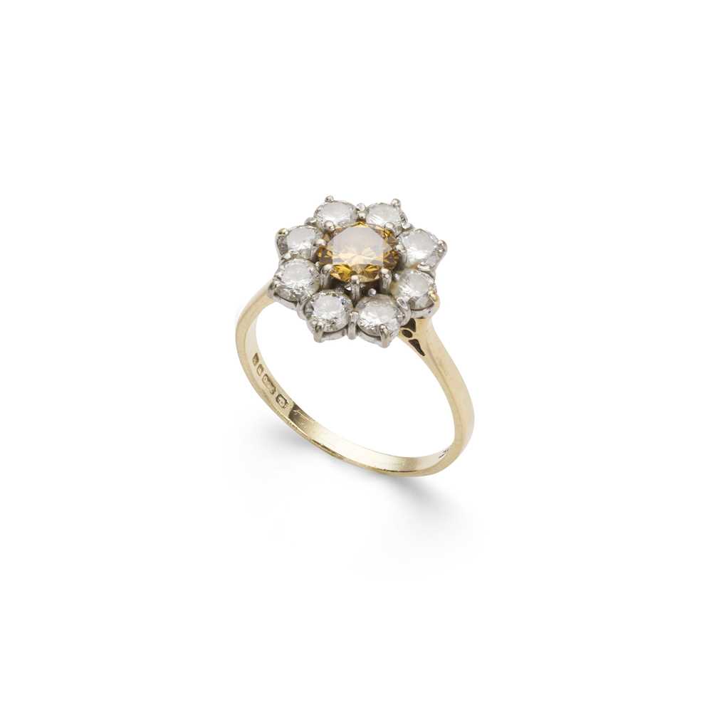 Lot 78 - A fancy yellowish-orange and colourless diamond cluster ring