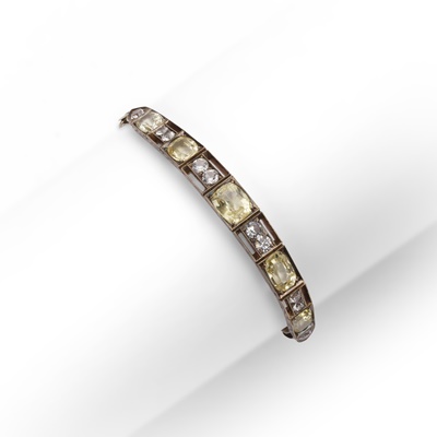 Lot 247 - A yellow and colourless sapphire bracelet