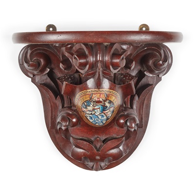 Lot 11 - A CARVED MAHOGANY AND POLYCHROMED ARMORIAL WALL BRACKET