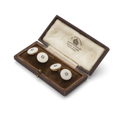 Lot 255 - A pair of carved shell and diamond cufflinks