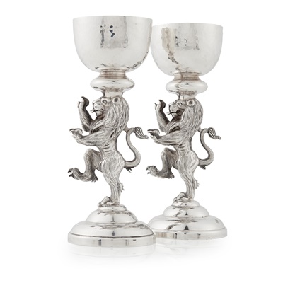 Lot 54 - A pair of cast modern figural candlesticks