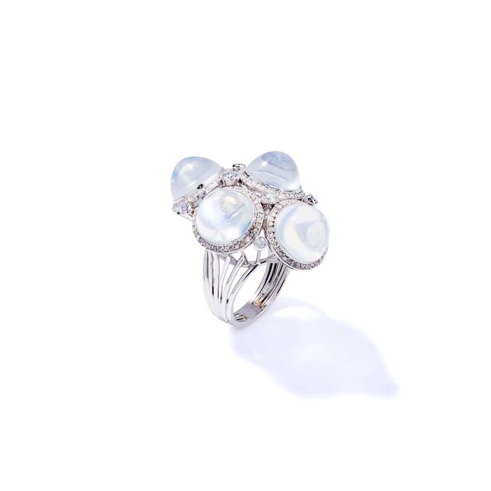 Lot 81 - A moonstone and diamond dress ring