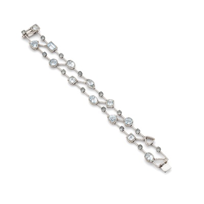 Lot 235 - An aquamarine and diamond bracelet