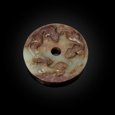 Lot 84 - PALE CELADON JADE WITH RUSSET SKIN 'CHI-DRAGON' DISC