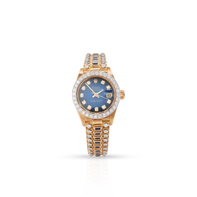 Lot 314 - Rolex: a sapphire and diamond-set gold wristwatch