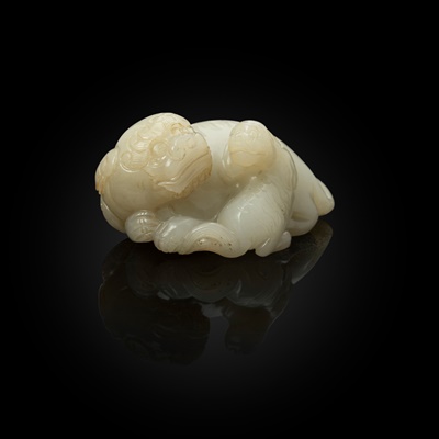 Lot 90 - WHITE JADE CARVING OF A LION DOG AND CUB