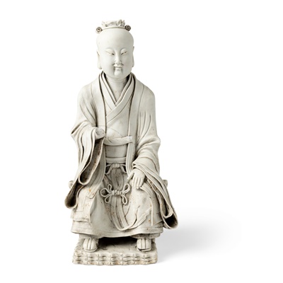 Lot 128 - CARVED PORCELAIN FIGURE OF A SEATED DAOIST IMMORTAL