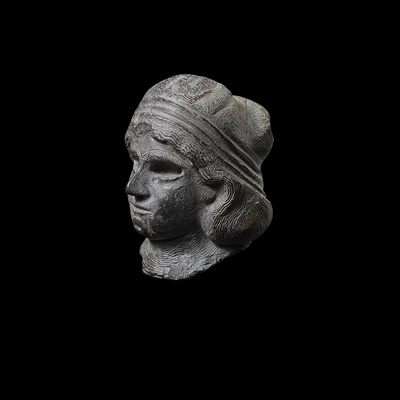 Lot 46 - MESOPOTAMIAN HEAD OF A FEMALE WORSHIPPER