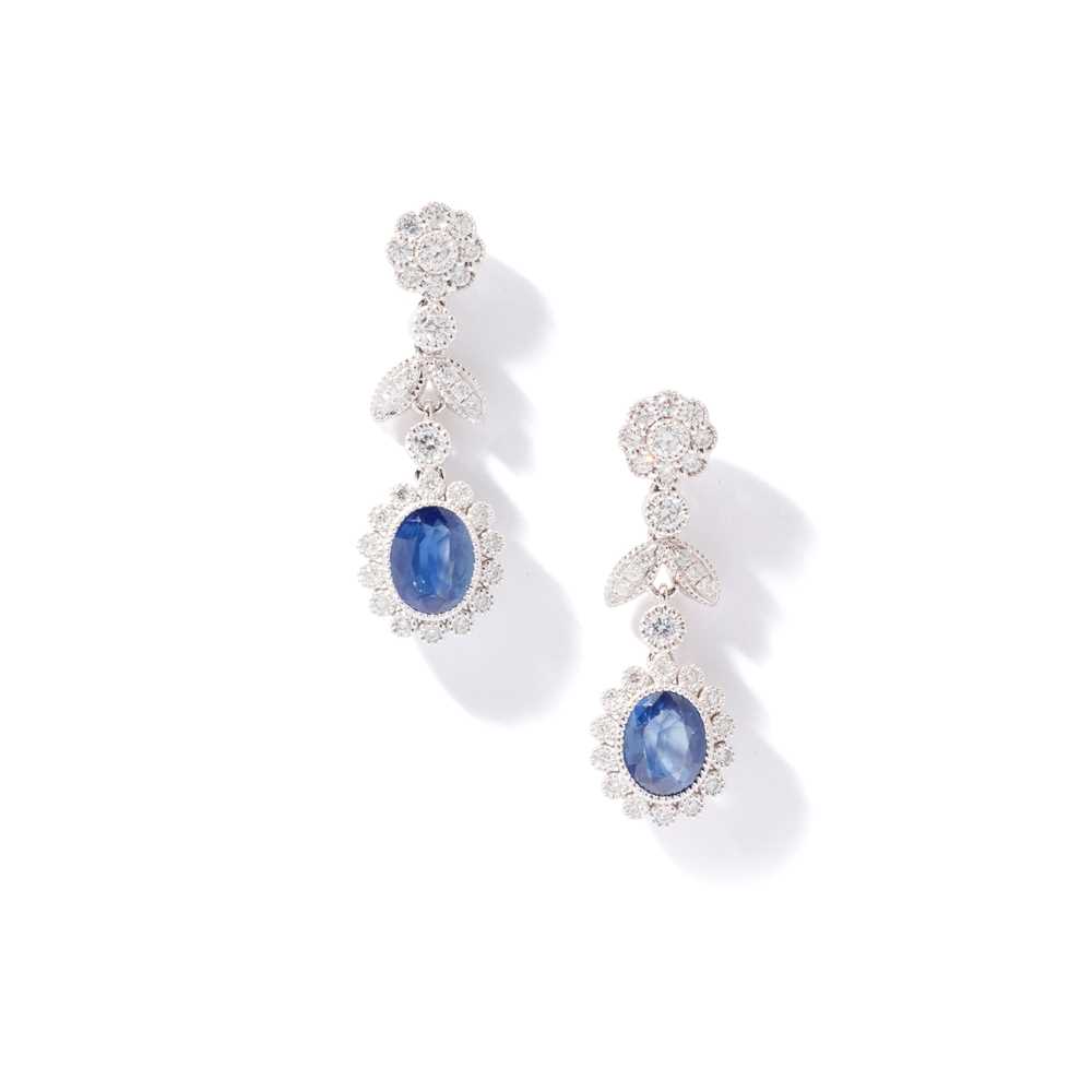 Lot 75 - A pair of sapphire and diamond pendent earrings
