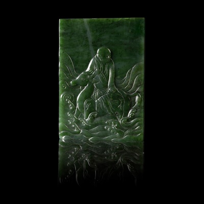 Lot 92 - SPINACH-GREEN JADE TABLE SCREEN INCISED WITH AN ARHAT ON DEER