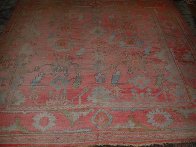 Lot 174 - An Ushak carpet, the rose field with serrated...