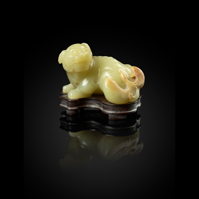 Lot 87 - YELLOW JADE WITH RUSSET SKIN CARVING OF A LION DOG