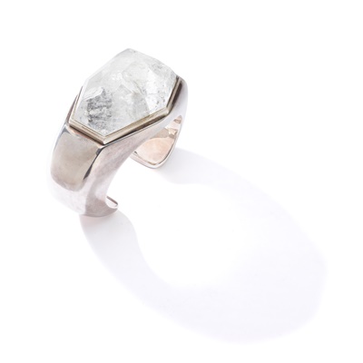 Lot 111 - A rock crystal and silver bangle