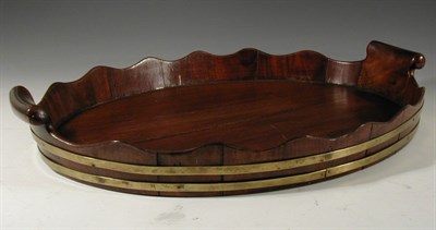 Lot 122 - A Georgian mahogany tray, NOTE of staved oval...