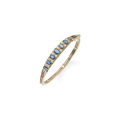 Lot 36 - A sapphire and diamond bangle