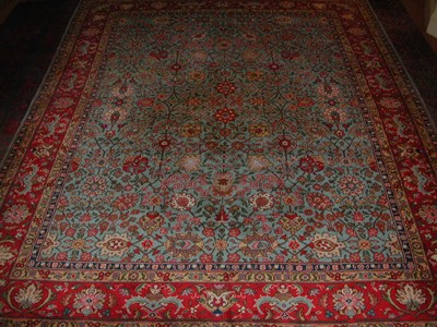 Lot 176 - A Tabriz carpet, the light blue field with...