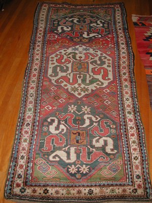 Lot 180 - A Chondzorek rug, the red field with one white...