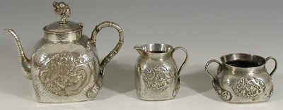 Lot 126 - A late 19th century Chinese white metal three piece tea service