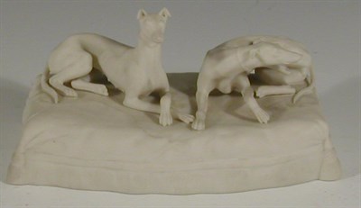 Lot 33 - A late 19th century parian ware cast figure of two greyhounds