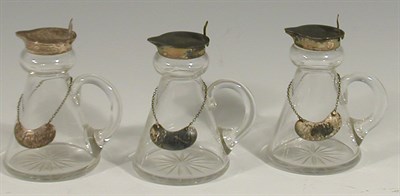 Lot 15 - A set of three glass whisky tots