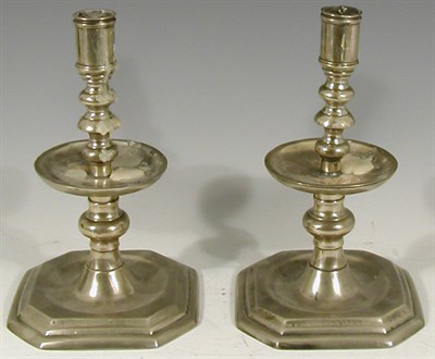 Lot 270 - A pair of silvered brass table candlesticks