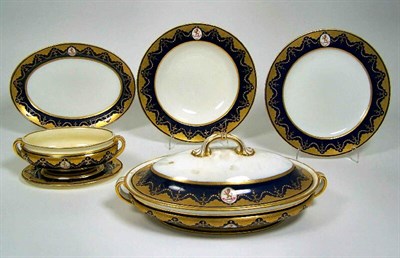Lot 17 - An early 20th century Mintons Armorial part dinner service