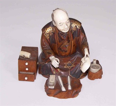 Lot 199 - A Japanese carved wood and ivory figure of a kneeling man<br/>Meiji period