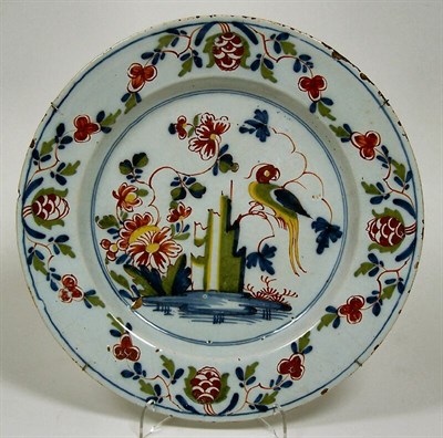 Lot 63 - An 18th century Delft polychrome painted charger