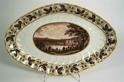 Lot 30 - A Flight & Barr scalloped oval topographical fruit dish<br/>depicting Chirke Castle, Denbighshire, circa 1795