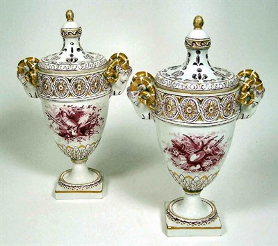 Lot 68 - A pair of 19th century French creamware urns and covers