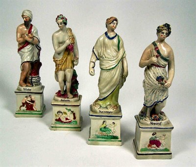 Lot 56 - A set of late 18th century Staffordshire pearlware figures of the four seasons<br/>Probably Enoch Wood